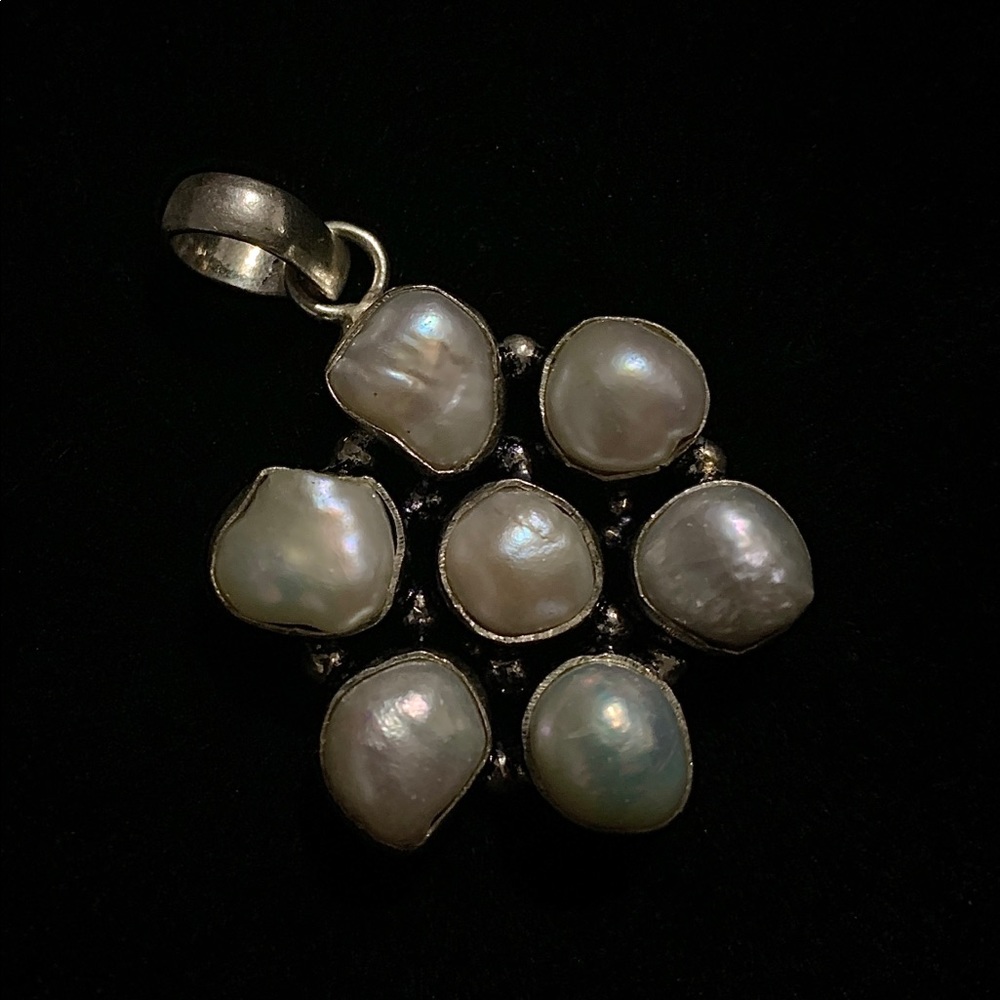 Pearls in silver pendant